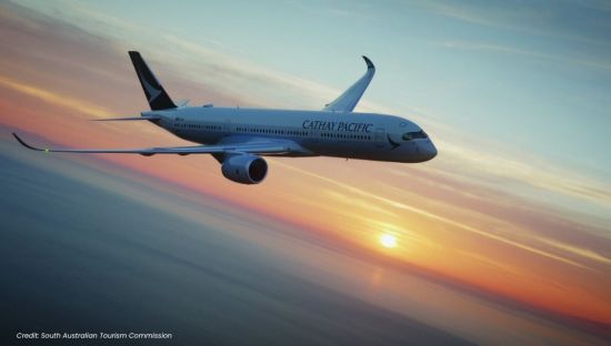 Cathay Pacific plane flying through the sky 
