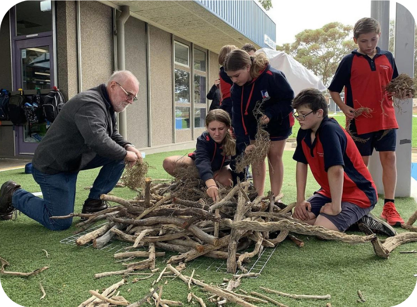  Rick Hawthorne helping Yorketown Area School students construct an osprey nest