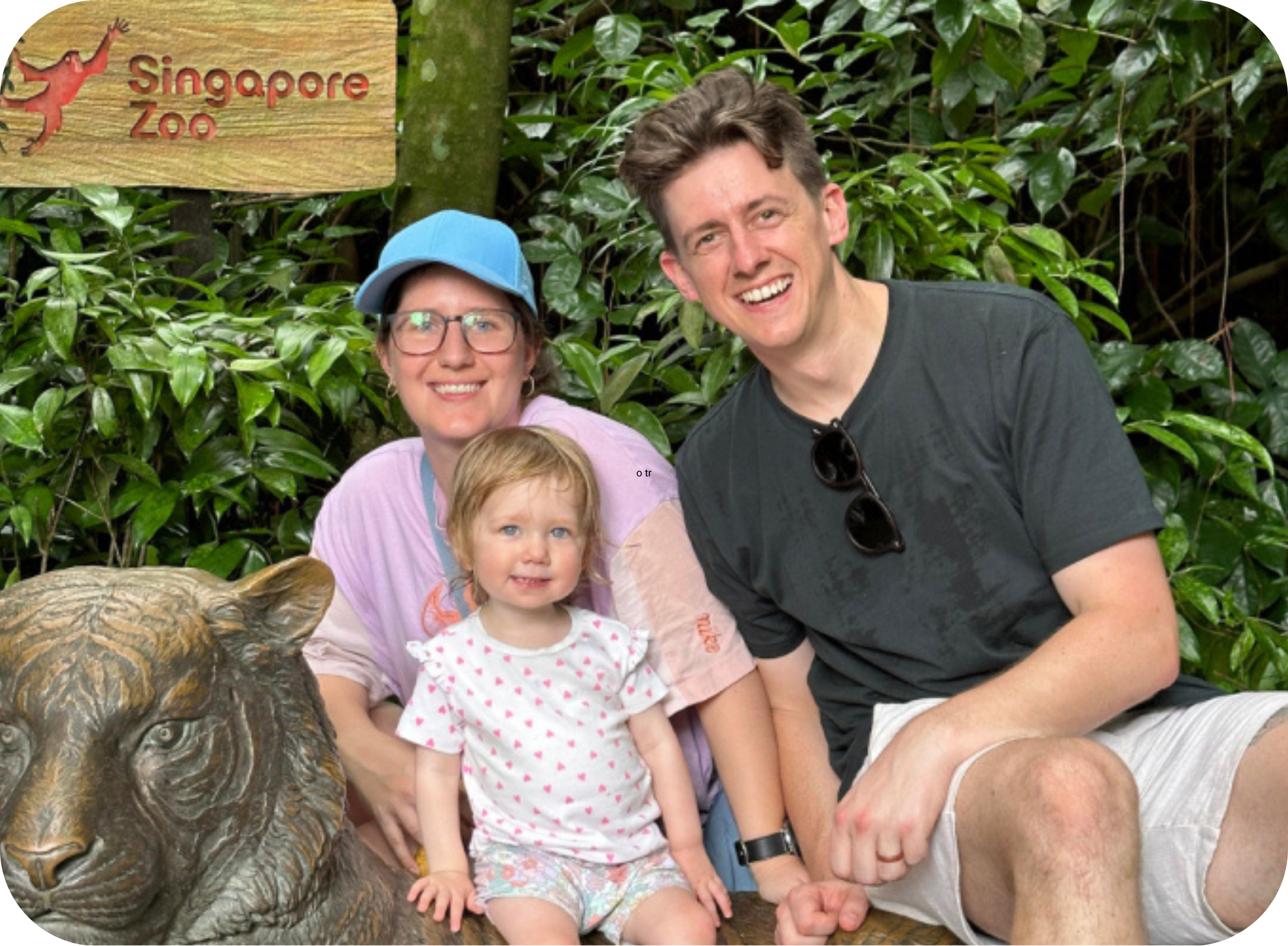 Young family of three pictured on holiday smiling