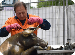 Image of Ian cleaning 'A Day Out' sculpture