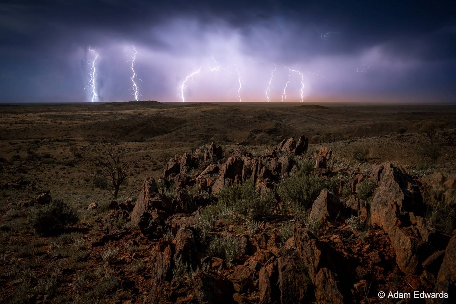 Image of lightning strikes hitting the ground.