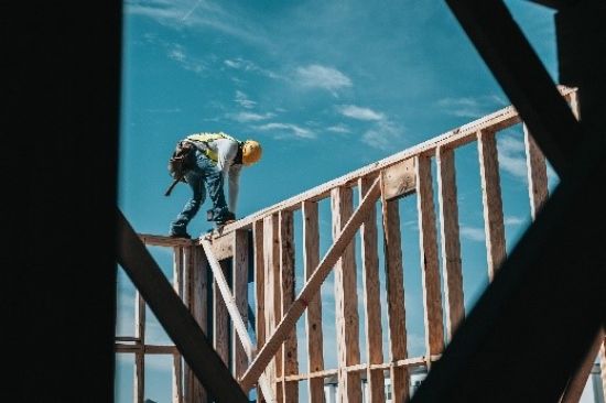 Image of a builder working on a new home under construction.