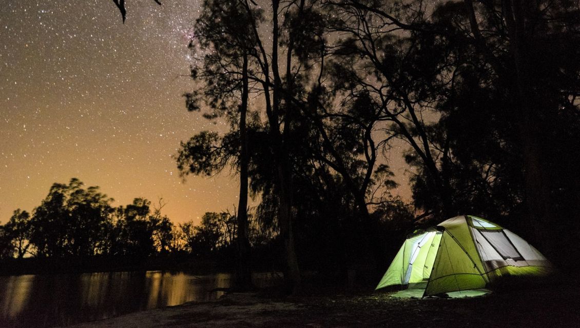 Image of a tent camping under the stars on the banks of the Murray River