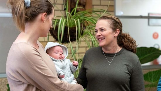 Image of a Loxton mum, Jess Storry with her baby Oscar, and local midwife Andrea Prokopec.