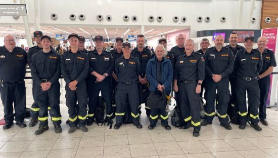 Image of a team of 16 SA CFS volunteers at Adelaide Airport headed to New South Wales fire effort.