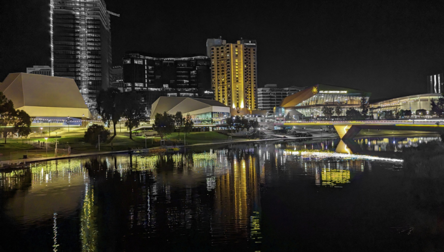 Image of Adelaide landmarks including Convention Centre and Riverbank Bridge lit up yellow for National Road Safety Week