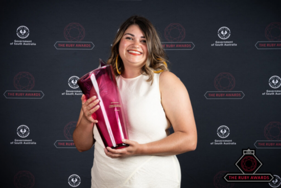 Lilla with the Frank Ford Memorial Young Achiever Award at the Ruby Awards.