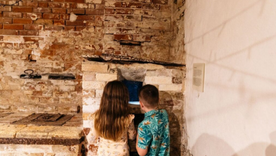 Image of the two people exploring the Old Treasury and Tunnels